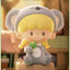 Cartoon figurine with animal ears and a blurred background