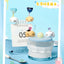 Cute cartoon character accessories on a glass container with a blue background