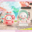 Two cute plush toys with cherry blossom background