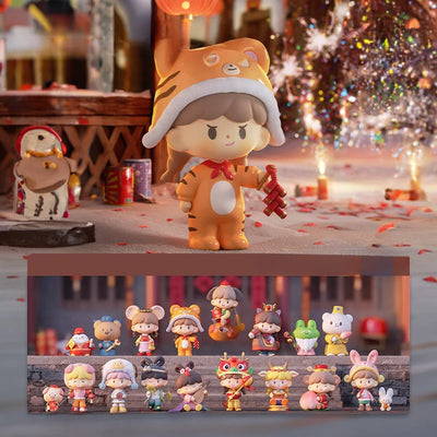 Collection of small figurines on a table with a festive background