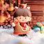 Toy figure of a character with a red hood and brown outfit in a snowy setting