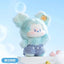 Plush toy with a light blue outfit and white hat on a light blue background
