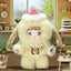 Plush toy with a design resembling a character from a cartoon or anime, set in a cozy room with decor.
