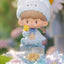 Cute figurine of a bear holding a popsicle with a blurred background