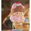 Cute character figurine shaped like an ice cream cone with a blurred background