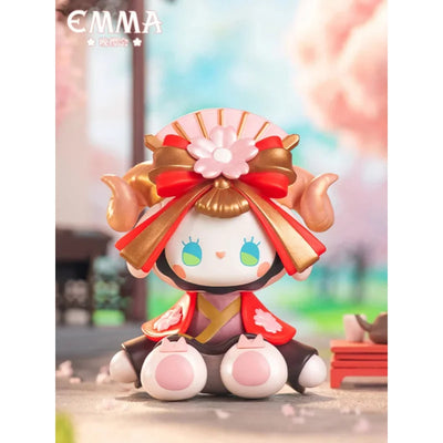 Animated character figurine with traditional attire and cherry blossoms in the background