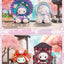 Three colorful character figurines with a cherry blossom background