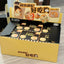 Open box containing 'Haoxiang' snack packages with cartoon dog design on a wooden floor.