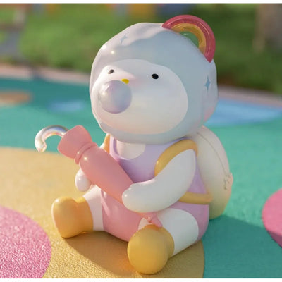 Toy figure of a cartoon character with a rainbow hair accessory on a colorful background