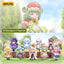 Collection of small figurines with a scenic background, featuring the brand '52TOYS'.