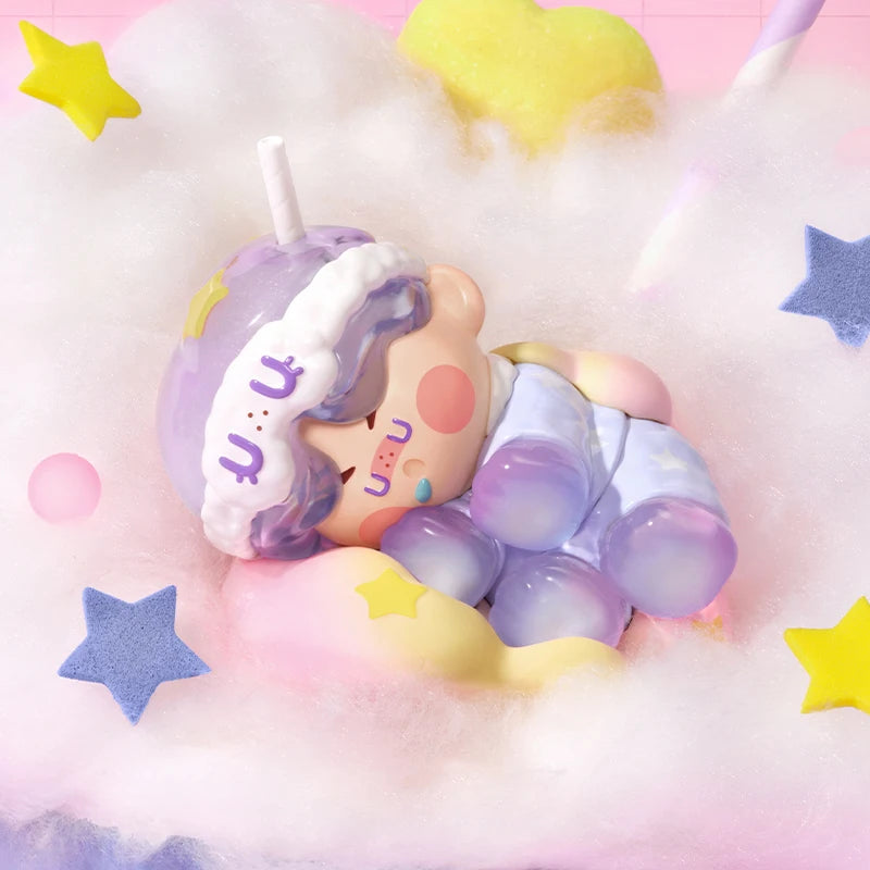 Cute plush toy with a unicorn design on a soft, cloud-like background with stars.