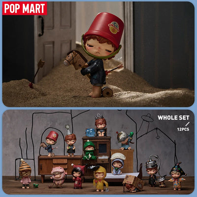 Toy figure with a red hat and horse, displayed with a set of other toy figures on a wooden surface.