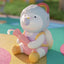 Cute cartoon character toy with a rainbow on a colorful background