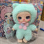 Toy figure in a light blue outfit with a pink flower, standing in front of colorful packaging.
