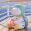 Toy figure of a character with a helmet and backpack sitting on a surface with a blurred background