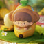 Toy figure of a monkey inside a banana with a green background
