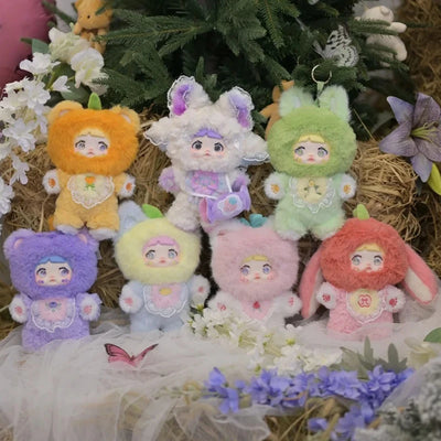 Set of colorful plush toys with animal-themed costumes on a decorative background with flowers and greenery.