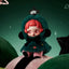 Toy figure with red hair and green fur coat on a dark green background