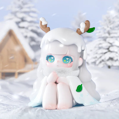 Toy figure with white hair and deer antlers in a snowy landscape