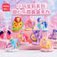 Collection of colorful toy ponies on a pink stand with MINISO branding.
