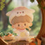 Cute cartoon character with a sheep costume sitting outdoors with carrots and a basket.