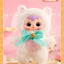 Plush toy with a white fluffy outfit and colorful bow on a pink background
