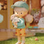 Decorative figurine of a child holding a teddy bear with a blurred background