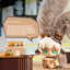 Toy figure with a speech bubble explaining blind boxes, set against a blurred indoor background.
