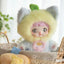 Stuffed animal with a fluffy yellow hood and cat ears, sitting in a basket.