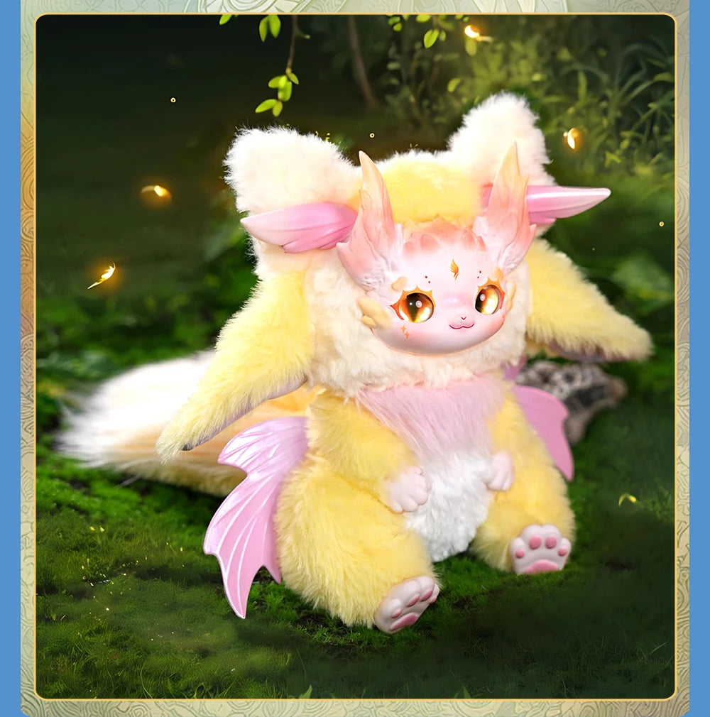 Plush toy of a fantasy creature with pink and yellow colors sitting on grass.