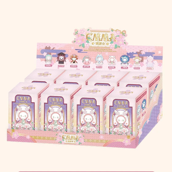Display of Enma-themed boxes with cartoon characters on a white background