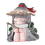 Animated character figurine with a large hat and staff on a white background