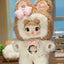 Plush toy with brown ears and white body in a room setting