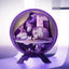 Decorative figurine with a purple base and a small character inside on a white background