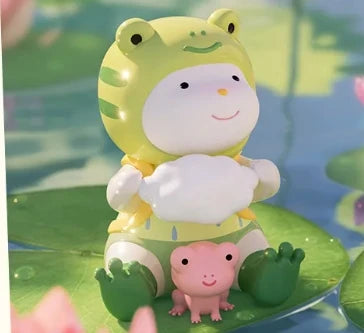 Toy frog character with a smaller pink frog on a green leaf