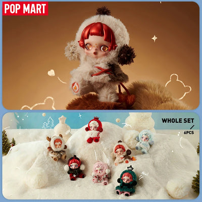Collection of small dolls in winter outfits with Pop Mart branding.