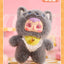 Plush toy with cat-like design on a pink background