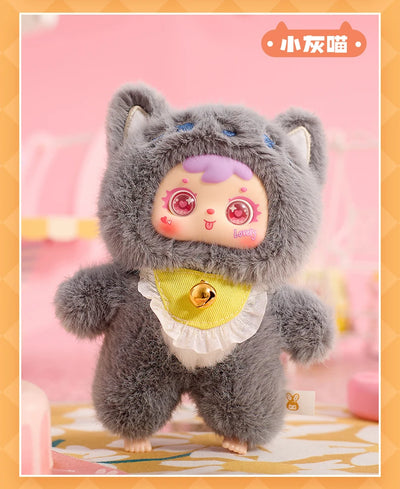 Plush toy with cat-like design on a pink background