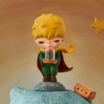 POP MART Hirono × Le Petit Prince figure with a rose in a glass case with a yellow scarf